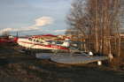 Cessna 180 beside floats